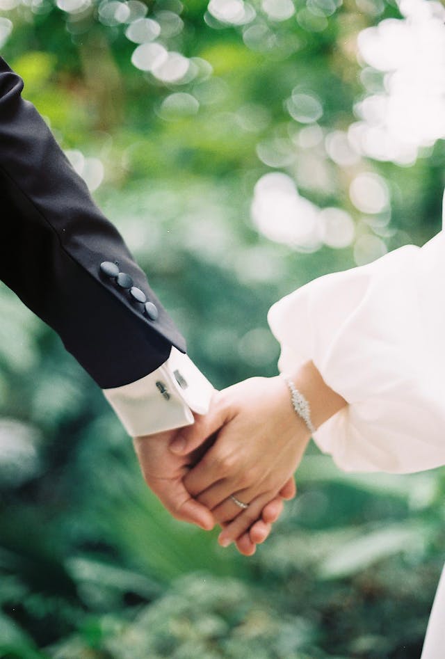 Bride and groom exchanging rings